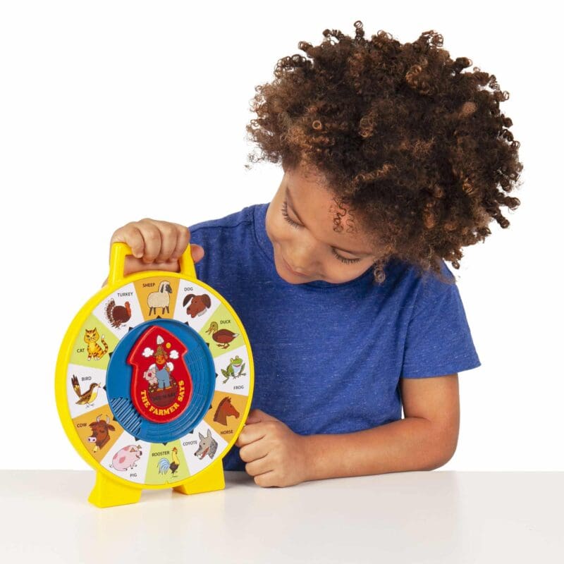 2070-Fisher-Price-See-N-Say-Lifestyle4-web Lifestyle shot of boy looking at the Fisher-Price See N Say on a table top